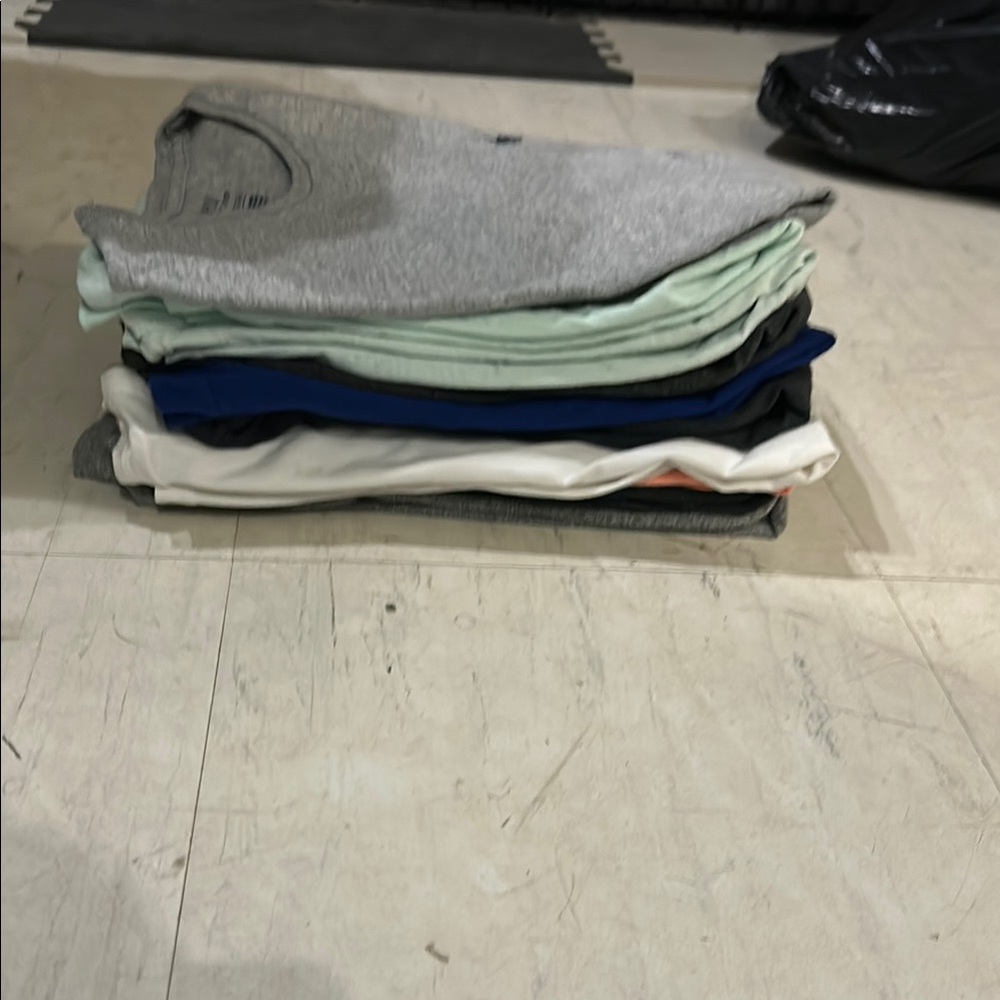 Stack of assorted t-shirts